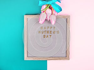 Mother`s day greetings on letter board and tulips