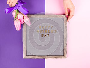 Mother`s day greetings on letter board and tulips