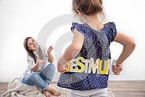 Mother`s day. A little cute daughter congratulates her mother