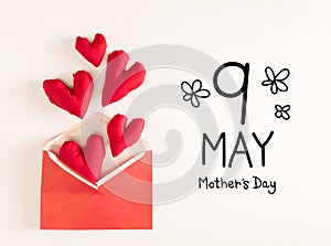Mother's Day message with red heart cushions