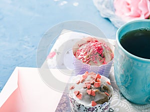 Mother`s day Valentine concept muffins cup tea envelope