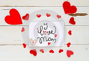 Mother`s Day vintage overhead composition of hearts and hand drawn greeting