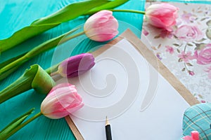 Mother`s Day, woman`s day. tulips ,presents and letter on wooden background