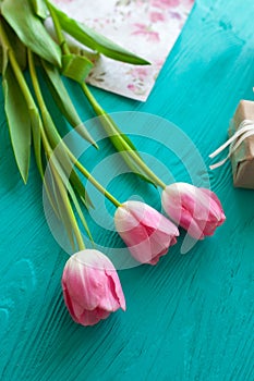 Mother`s Day, woman`s day. tulips ,presents on wooden background