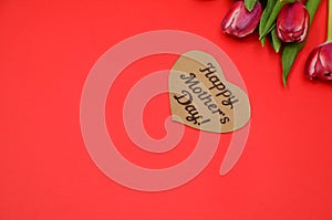 Mother's Day, woman's day. tulips ,presents on wooden white background, greeting card with the inscription