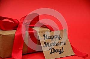 Mother's Day, woman's day. tulips ,presents on wooden white background, greeting card with the inscription