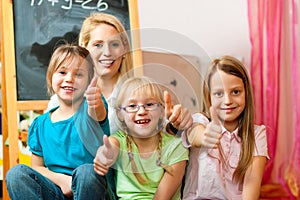 Mother with schoolchildren