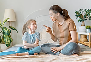 Mother is scolding her child girl