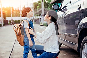 Mother sent the children to go to school in semester start day.