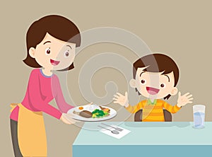 Mother serving food to son