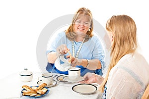 Mother Serving Tea to Daughter