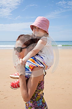 Mother shouldering baby