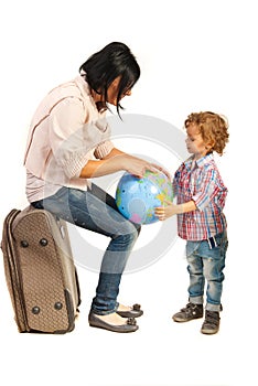 Mother showing her son on world globe