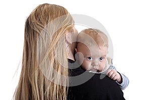 Mother with small baby boy on her shoulder