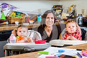 Mother Smiles With Babies