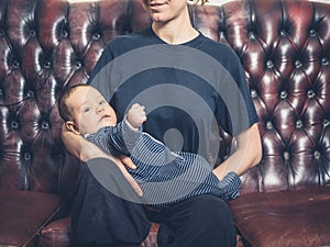 Mother on sofa with baby