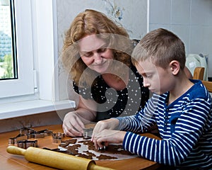 Mother and son baking cookies