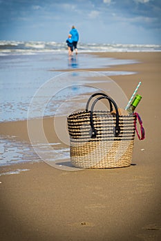 Mother and son on the beach afar off