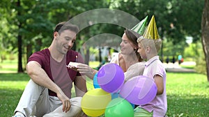 Mother and son congratulate dad on birthday, pleasant surprise from close people