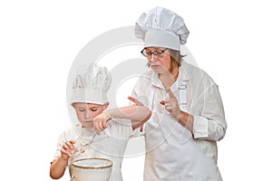 Mother and son cooking apple pie in the home kitchen, isolated on a w