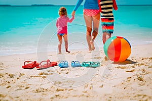 Mother with son and daughter walking at beach