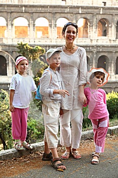 Mother, son and daughters are near Colosseum