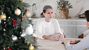 Mother and son discussing something on New Year holidays. Mother and son discussing something