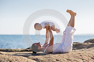 A mother and a son are doing yoga exercises