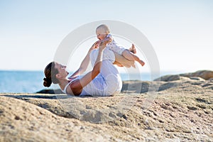 A mother and a son are doing yoga exercises