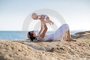 A mother and a son are doing yoga exercises