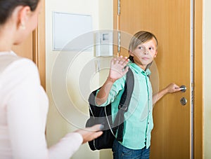 Mother with son at doorway