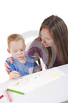 Mother and son are drawing the picture together