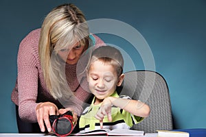 Mother and son drawing together