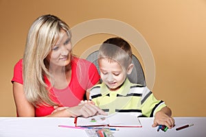 Mother and son drawing together