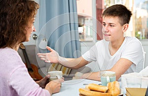 Mother and son enjoying conversation