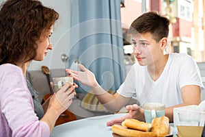 Mother and son enjoying conversation