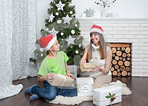 Mother and son are exchanged Christmas gifts