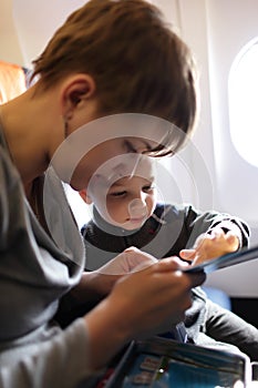Mother with son on the flight