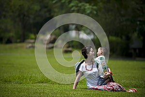 Mother and son in grass