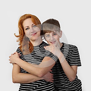 Mother and son on gray