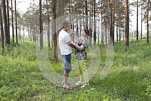 Mother and son had a dancing in a summer forest