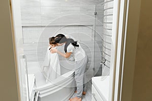 Mother And Son Having Fun At Bath Time Together