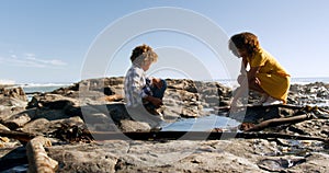 Mother and son having fun together at beach