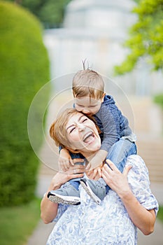 Mother and son having fun together, giggle, happy and smiling