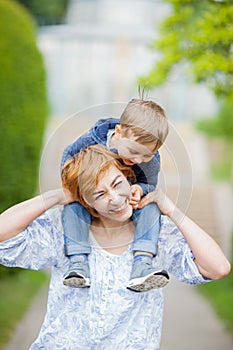 Mother and son having fun together, giggle, happy and smiling