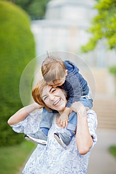 Mother and son having fun together, giggle, happy and smiling photo