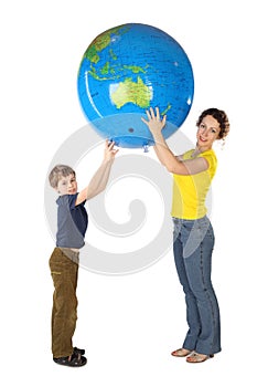 Mother and son holding big inflatable globe