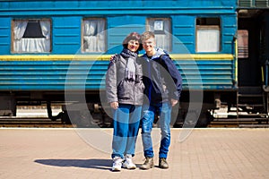 Mother and son hugging after long separation at railway station