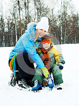 Mother and son ice skating