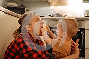 Mother and son in kitchen at home